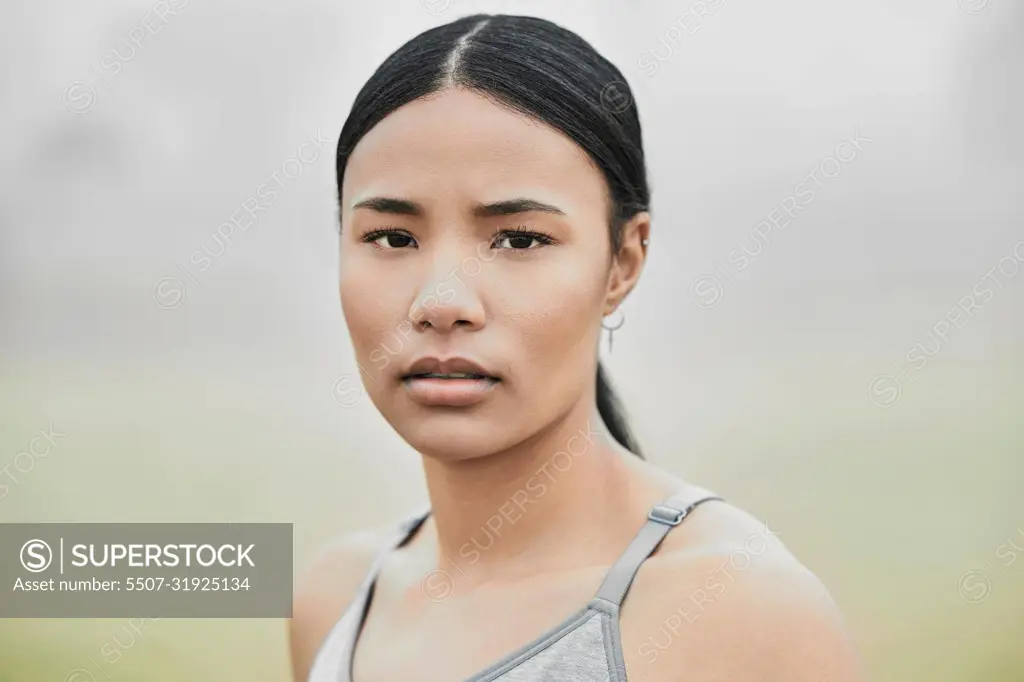 Keep looking forward. Cropped portrait of an attractive young female athlete exercising outside.