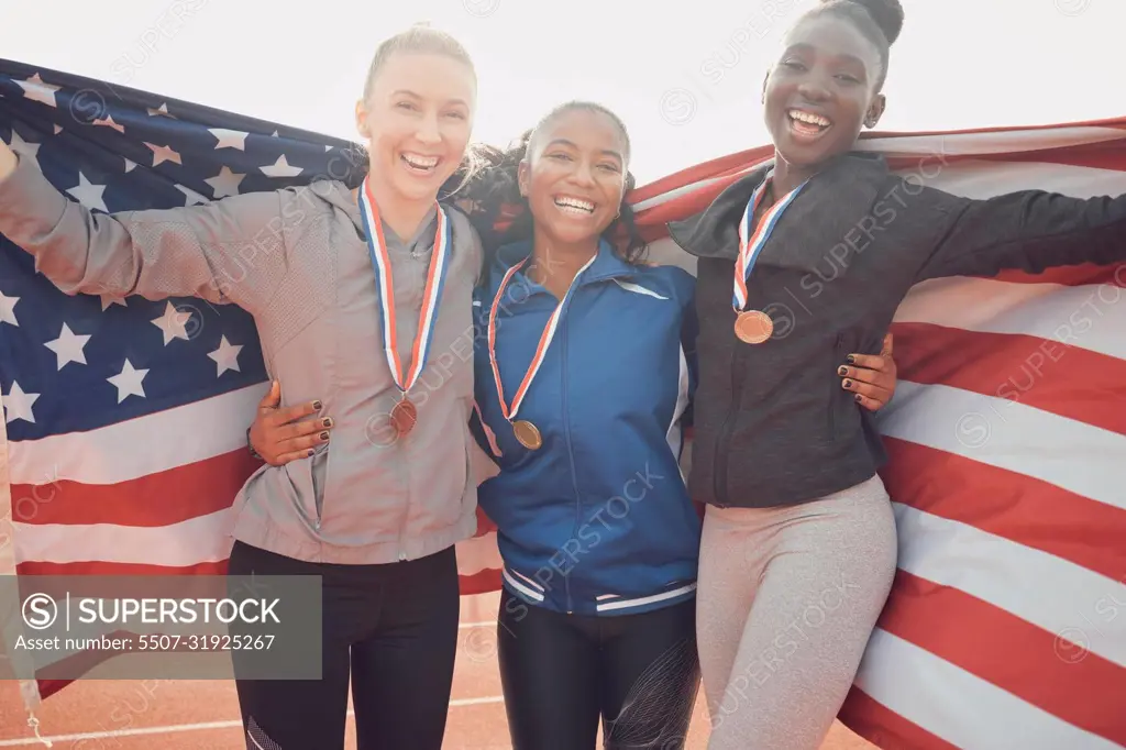 Cherish the team you have. a group of female athletes holding an american flag.