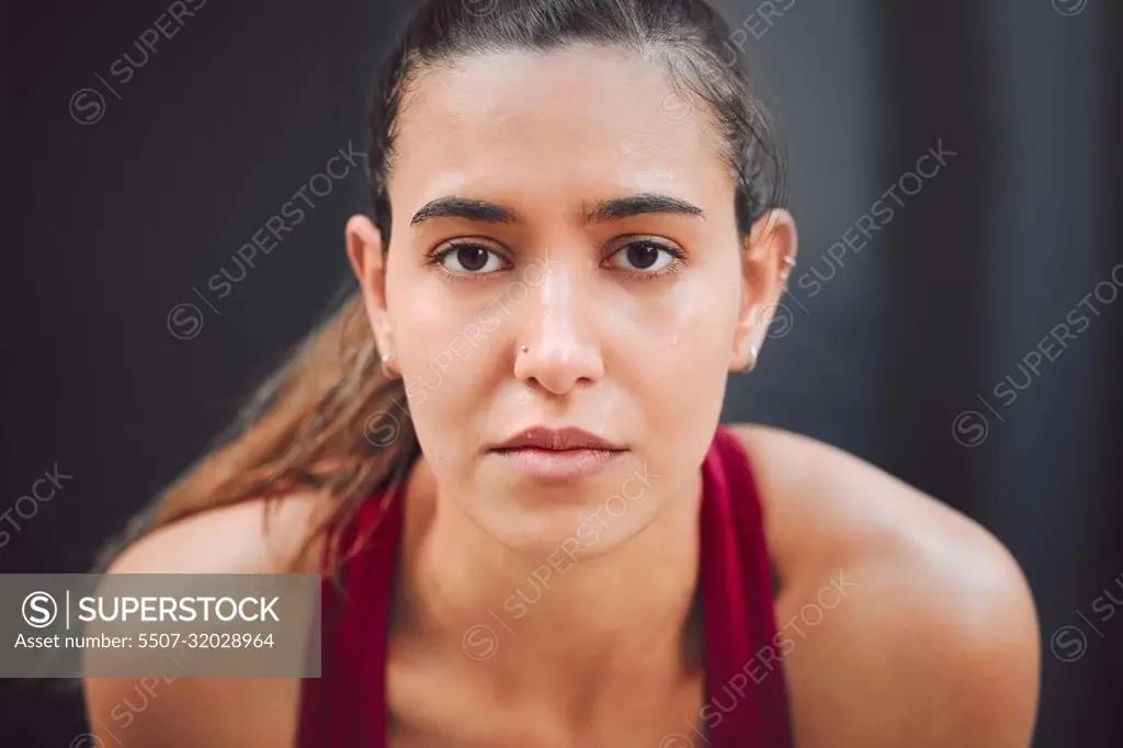 Focused on the run. Cropped portrait of an attractive young female athlete looking tired while running outdoors.