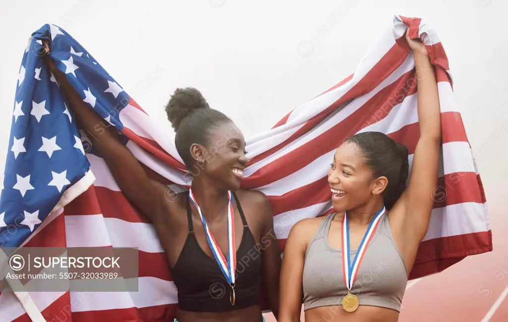 Theyve got that winning mentality. two attractive young female athletes celebrating their countrys victory.