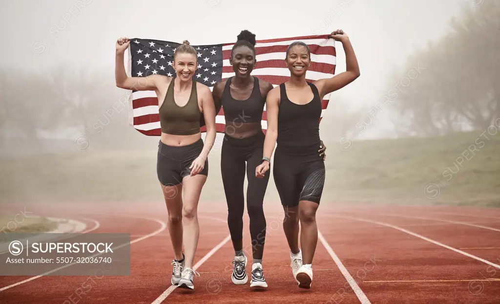 Marching our way to victory. a young sports team holding the american flag.