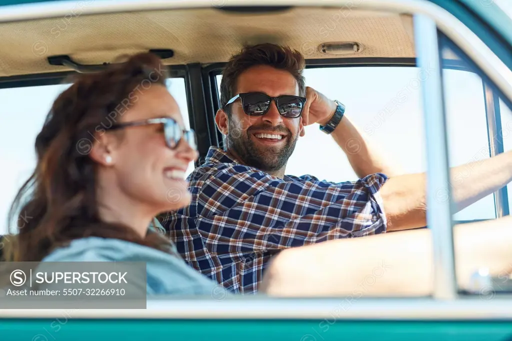 Theres nothing better than a roadtrip with her. an affectionate couple enjoying a summer roadtrip.