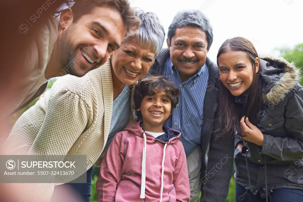 Simple moments make great memories. a multi-generational family posing for a self-portrait.