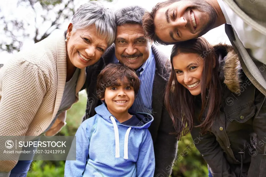 Theyre a close-knit family. a multi-generational family posing for a self-portrait.