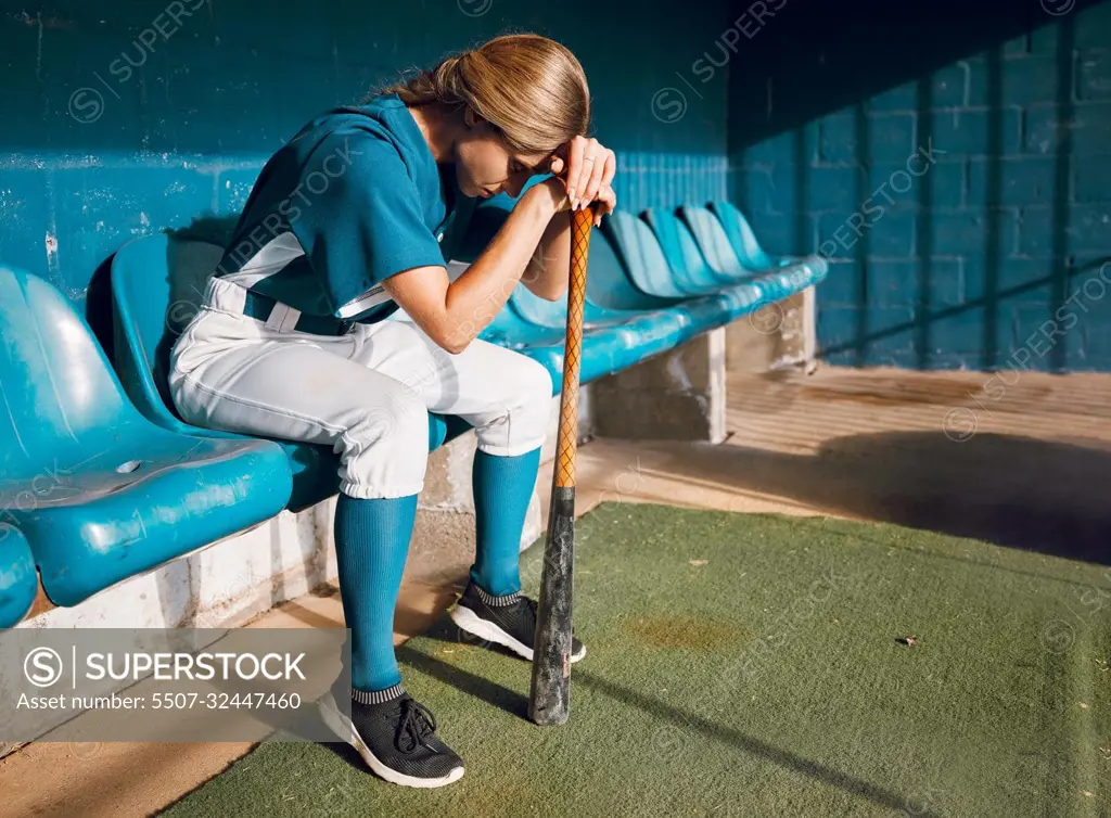 Baseball, sports bench and woman athlete angry thinking of game loss while waiting to play. Frustrated, sad and serious softball player girl in depressed mood for professional match failure.