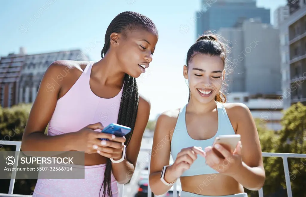 Friends, phone and laughing during exercise for social media, blog or meme while in city together. Women, smartphone and smile with diversity during training, workout or run in Los Angeles in summer