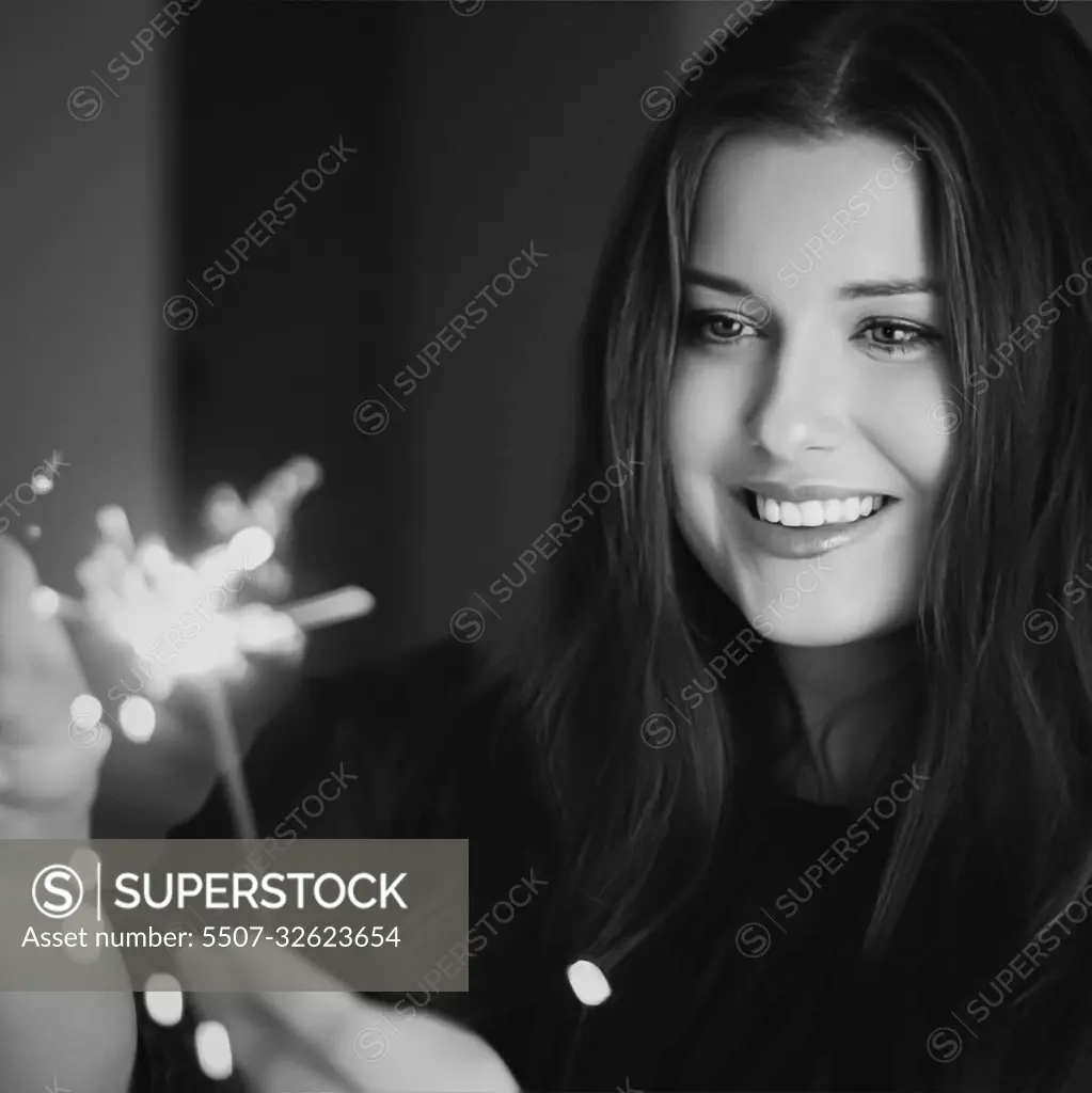 Holiday magic, Christmas and New Year celebration, happy woman with sparklers