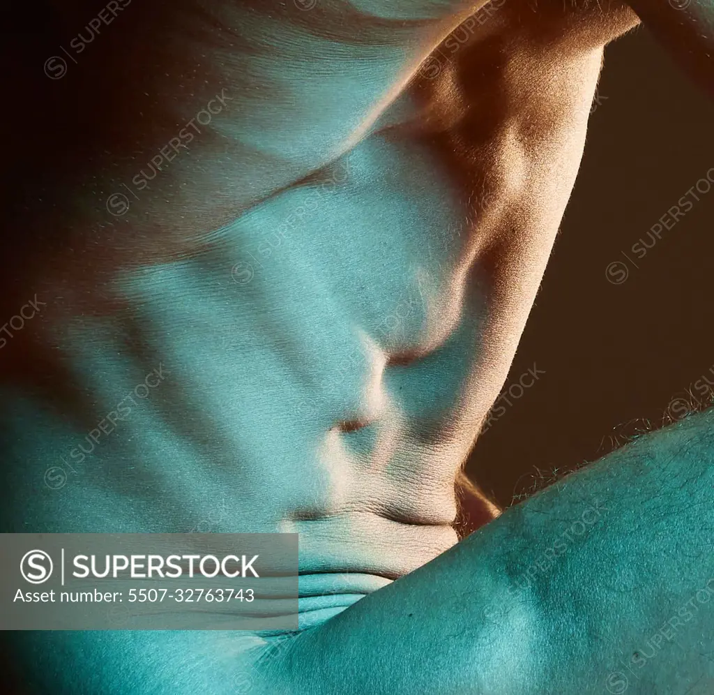 Muscle, body and sexy man nude, naked and topless guy or model isolated  against a dark studio background. Muscular, masculine and closeup of  artistic male torso or athletic and fit person -