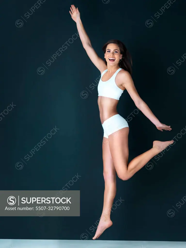 Im proud to be healthy. Studio portrait of a healthy-looking young woman against a dark background.