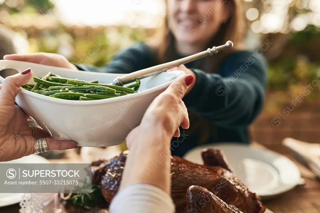 Food, hands and couple share healthy vegetables at dining room table for lunch, dinner and healthy meal together. Friends, healthy food and meal at table for quality time and bonding in family home