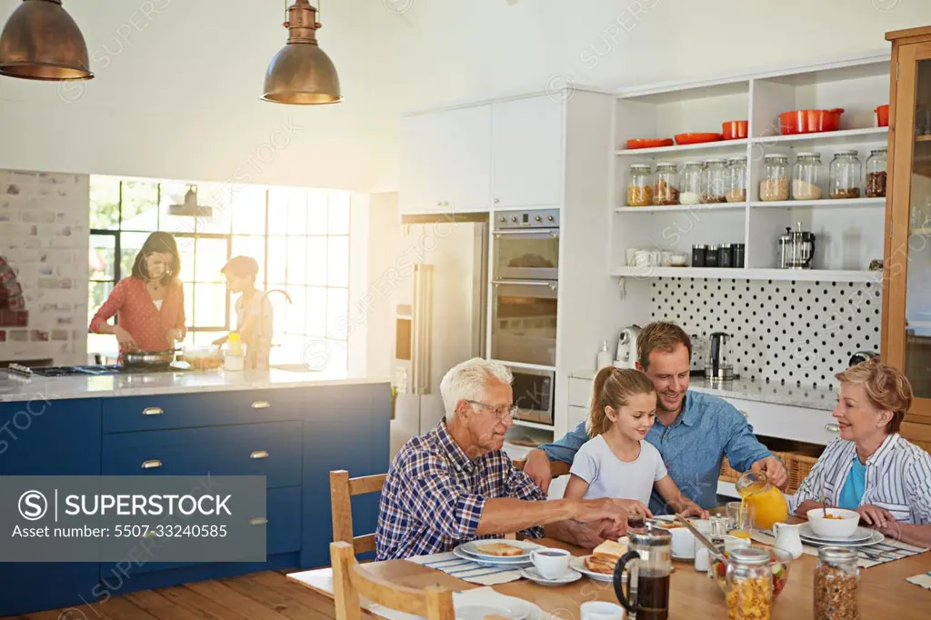 Starting the day with family. a multi generational family enjoying breakfast together at home.