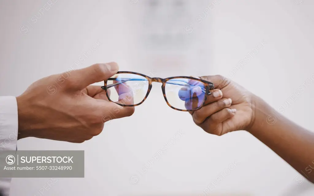 Glasses, optometry and hands of an optometrist and person for decision, buying and help with vision. Consulting, helping and an optician giving eyewear frames and prescription lenses to a customer