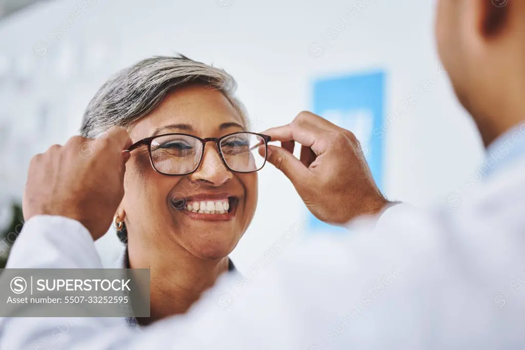 Optometry, smile and woman with prescription glasses, optician and helping client with product. Female person, employee and optometrist assist with eyewear, clear vision and buying new spectacles