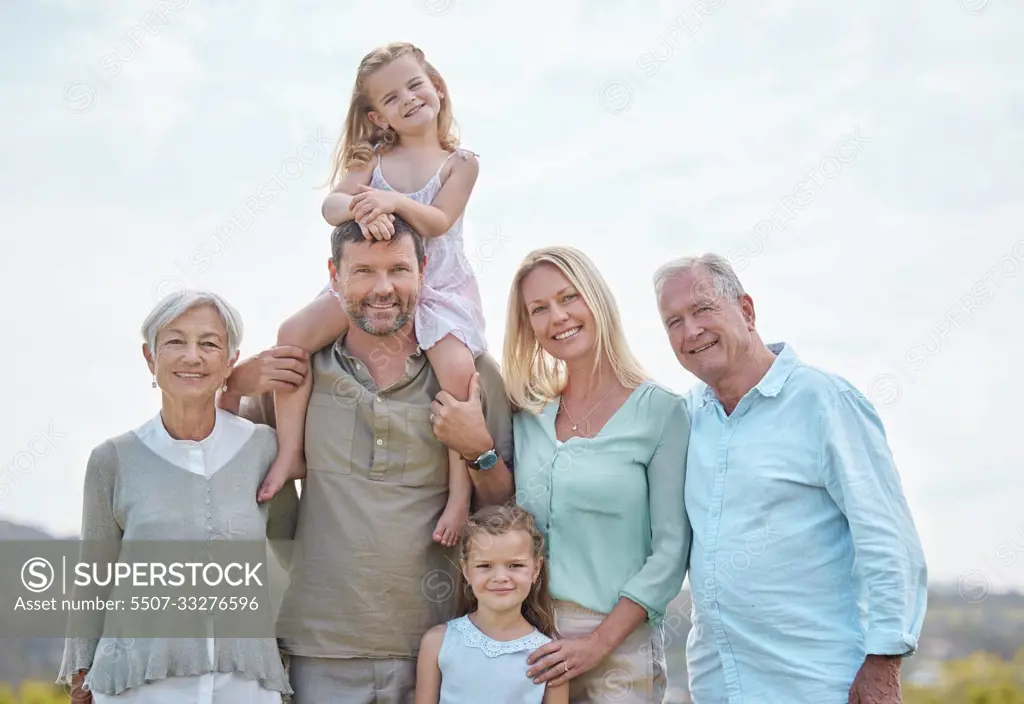 Family is not an important thing. Its everything. a multi-generational family standing together outside.