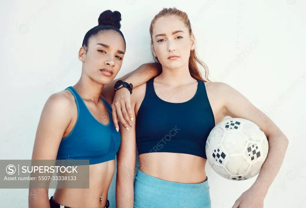 Soccer, women and portrait of friends with a ball standing by a white background for training. Fitness, football and girl athletes ready for a sports workout or exercise for a game together.