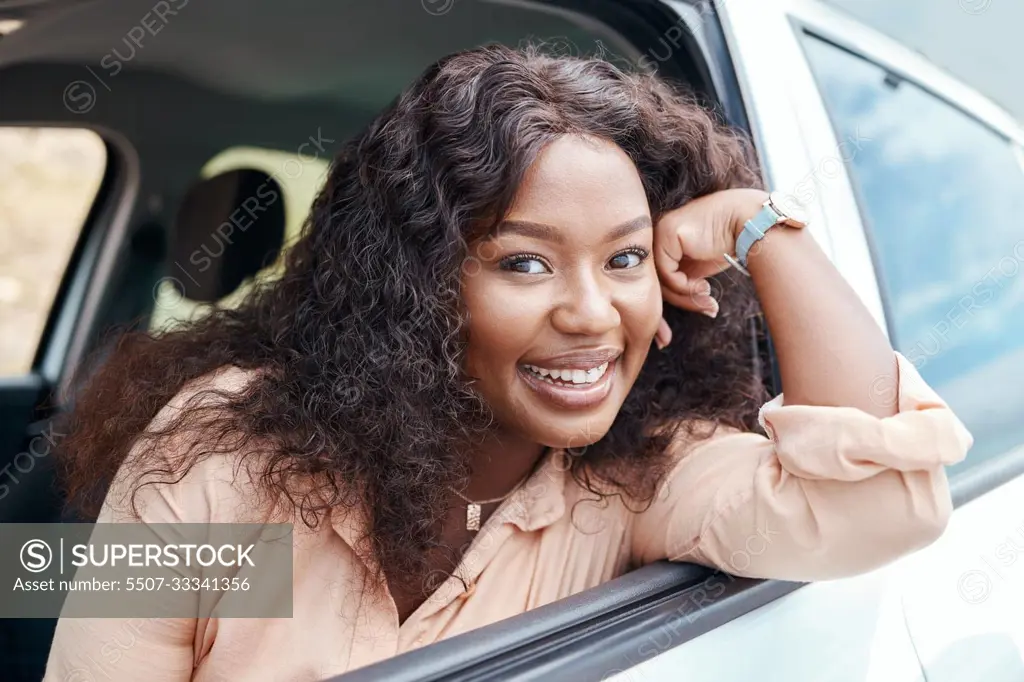 Black woman, happy and smile at window of car on road trip, travel or vacation. Portrait, woman and driver with happiness in transport on road, street or drive in sunshine outdoor in Cape Town