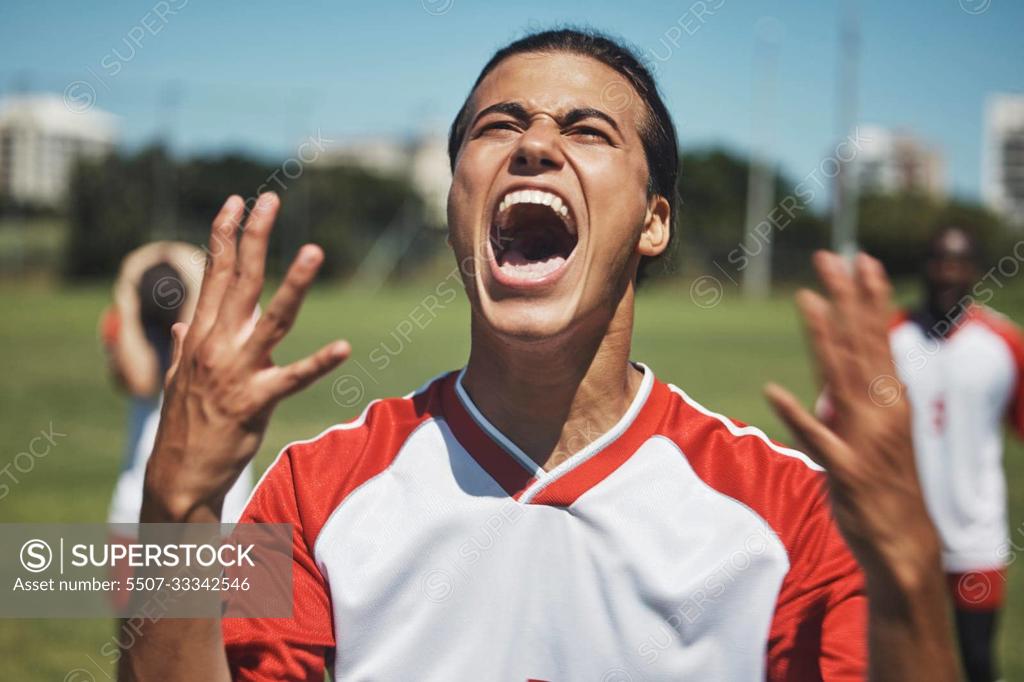 Download Energized soccer player celebrating victory on the field