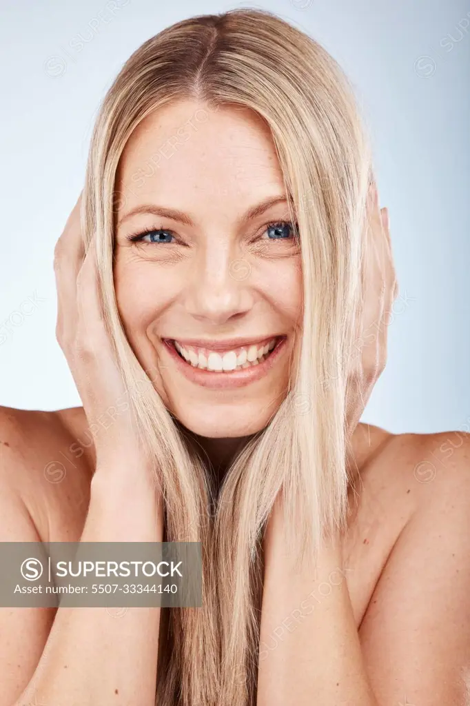 Hair, woman and portrait of a beauty woman for healthy haircare on a grey studio background. Hair care, wellness and hair care for a female with a hairstyle looking happy with her healthy hair