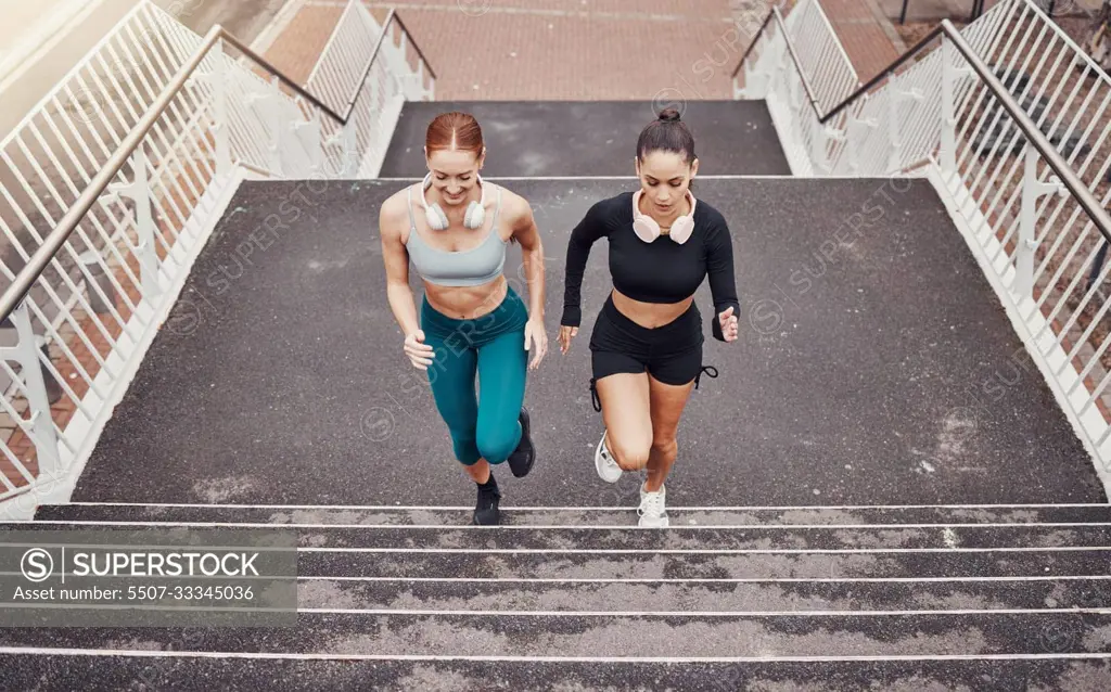 Fitness, sports or friends running on steps exercise together for healthy lifestyle, wellness or exercising for marathon. Athletes, runners or fast women training in cardio workout on stairs in city