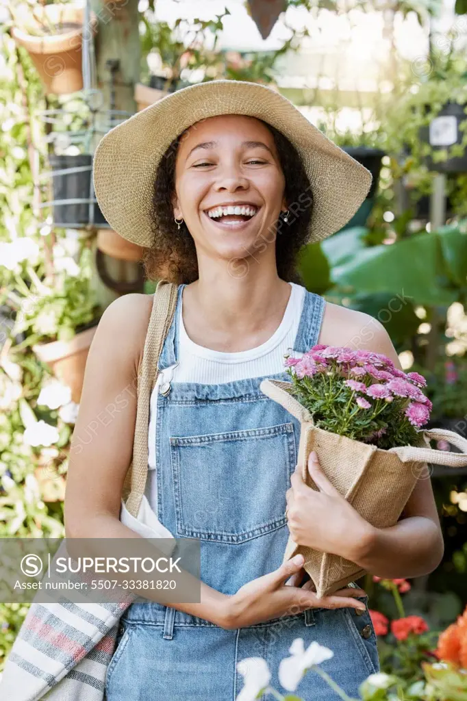 Flowers, happy and woman at a plant nursery shopping for floral products for her garden in nature. Happiness, smile and young female florist from Mexico buying a flower bouquet at sustainable market.