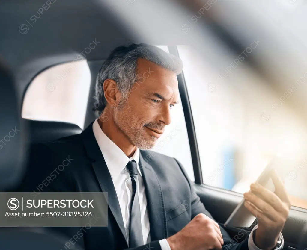 Business man, tablet and car for travel, journey or drive while online for communication. Professional male person with tech and internet connection for work with luxury transportation or a taxi