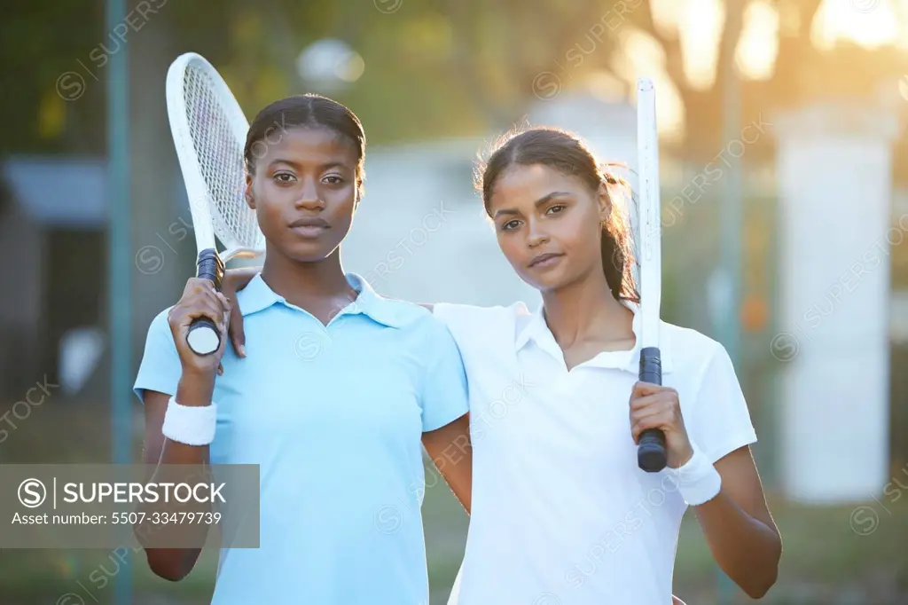 Portrait, tennis and teamwork with sports women standing on a court outdoor together ready for a game. Fitness, collaboration or doubles partner with a serious female athlete and friend outside