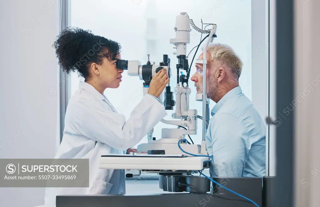 Vision, eye test and insurance with a doctor woman or optometrist testing the eyes of a man patient in a clinic. Hospital, medical or consulting with a female eyesight specialist and senior male