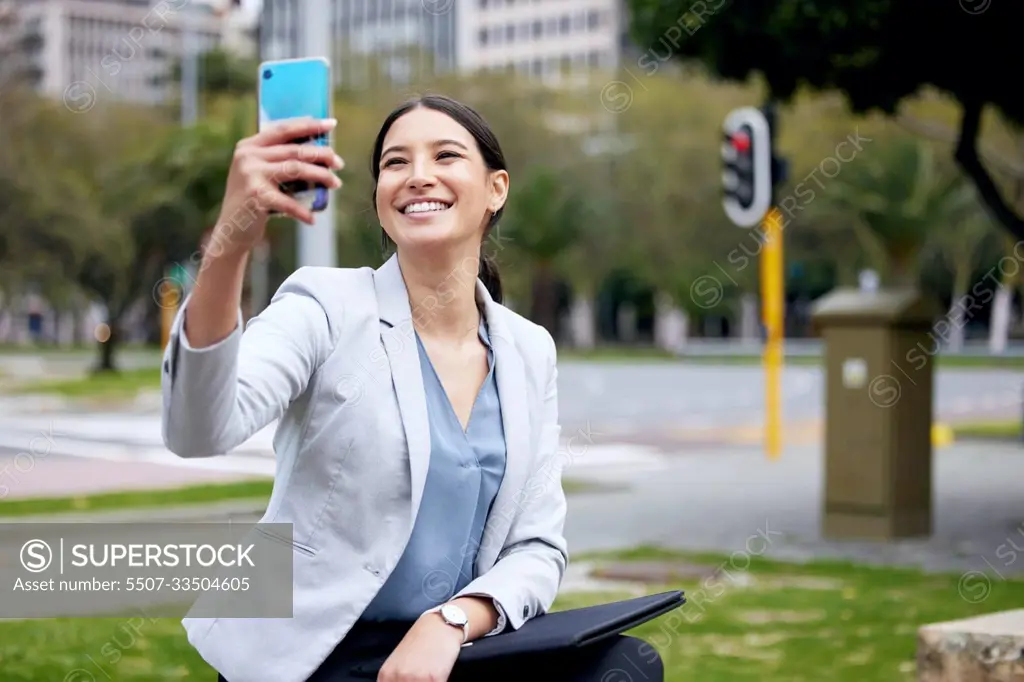 Business woman, selfie and travel with commute to work, communication and social media post in city. Young female professional, smile in picture with happiness, technology and urban with mockup space