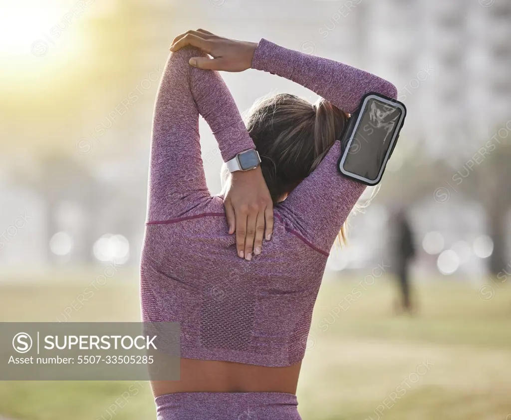 Back, woman and stretching outdoor, health and workout for wellness, fitness and training. Female, athlete and warm up for run, exercise and sports for cardio, energy and balance in nature and goals.