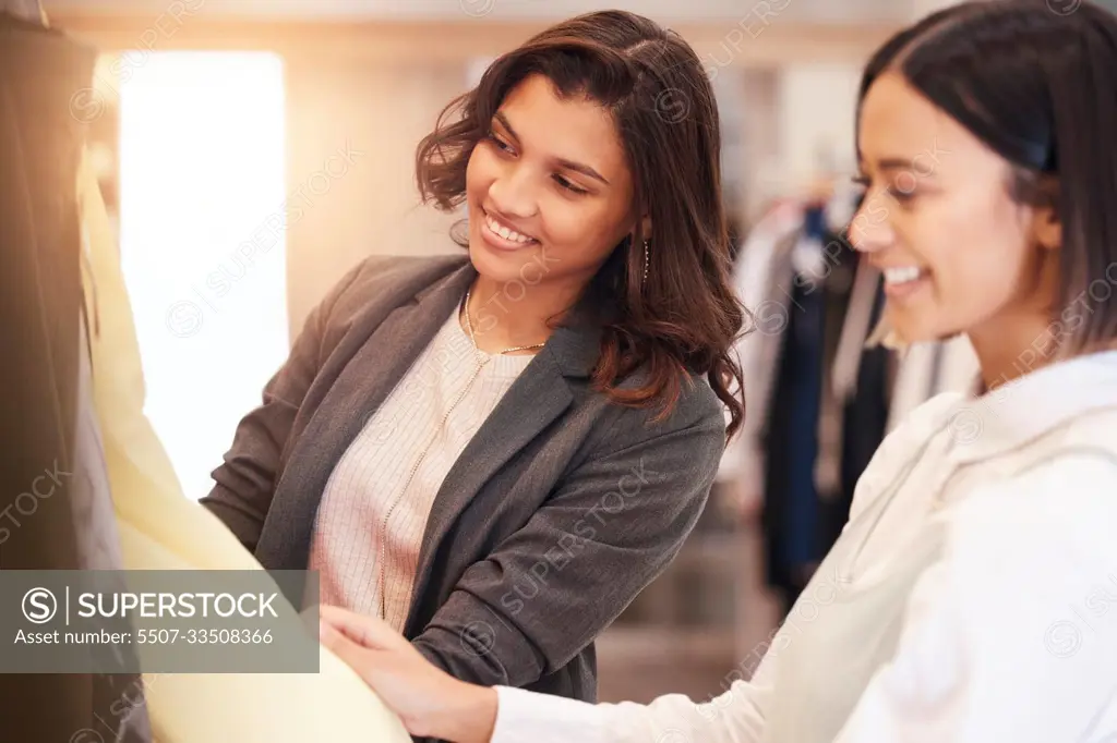 Fashion, retail and customer friends shopping in a mall together while searching for sales in a clothing store. Consumerism, smile, or happy with a woman and friend in a boutique shop to buy clothes