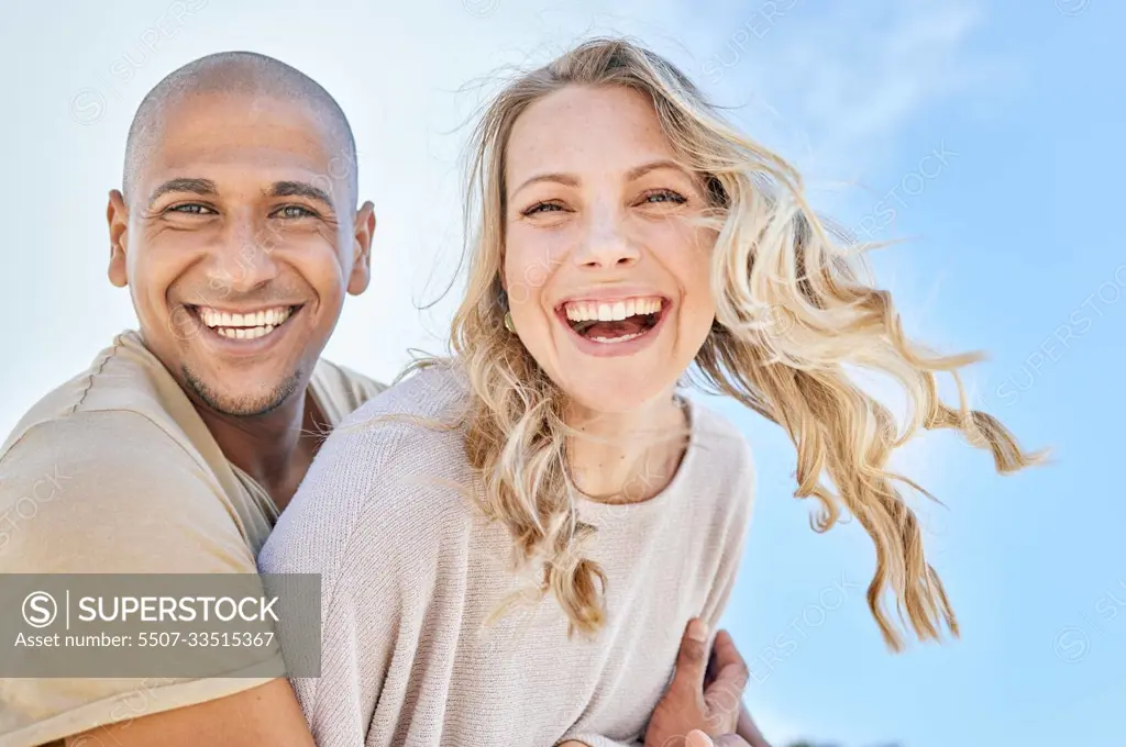 Love, blue sky and diversity couple hug, laugh and enjoy fun quality time together on travel vacation date. Happy, smile and romantic black man, woman or excited people bond on Toronto Canada holiday