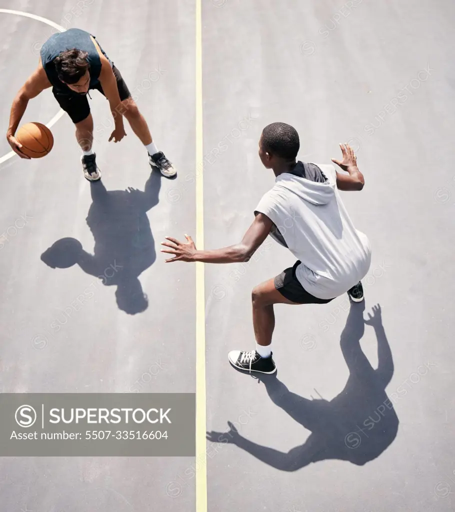 Basketball and basketball player on the court from above for a game during summer for fitness and sport. Sports, active and youth playing competitive match for cardio, stamina and tournament