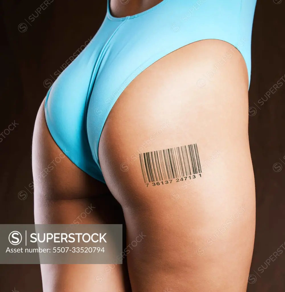 Human trafficking, slavery and woman with barcode on body for prostitution,  for sale and purchase in studio. Sex trade, escort and butt of female with  label icon, tattoo and symbol on dark