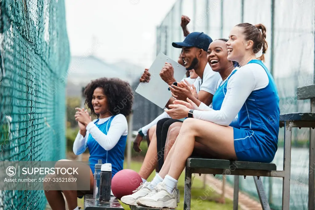 Court, netball and happy coach with women on stand watching game, match and practice on court. Coaching, teamwork and female athletes cheer for support, motivation and excited for sports competition