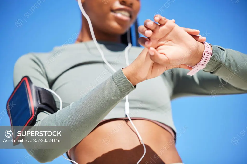 Fitness, smart watch and black woman with progress, outdoor or checking time with workout goal, training or earphones. Female person, girl or athlete with tracker, activity or cellphone with practice