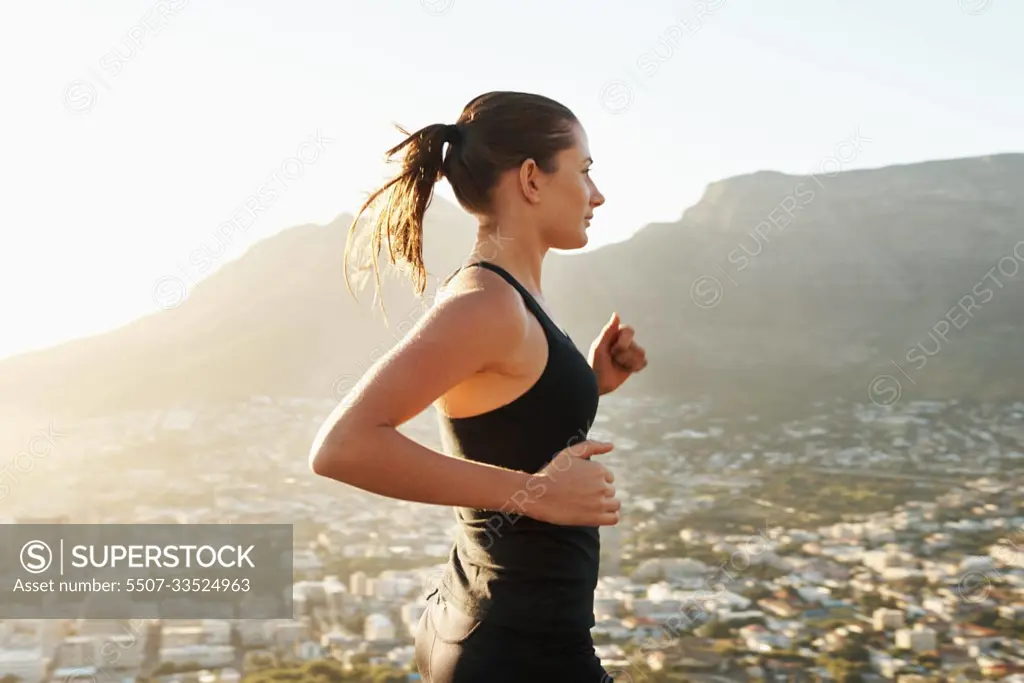 Running, fitness and woman with balance, exercise and cardio with healthy lifestyle, wellness and workout. Female person, runner and athlete outdoor, view and target with performance, goal and sports