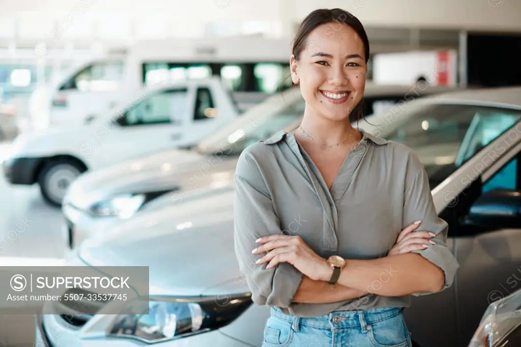 Ive found the one. a young woman standing next to the car shes about to buy.