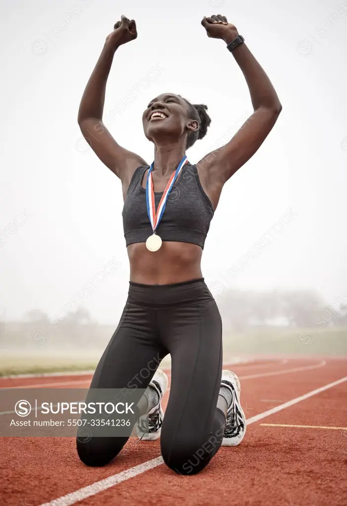 Ive never wanted anything more. a young female athlete celebrating her run.