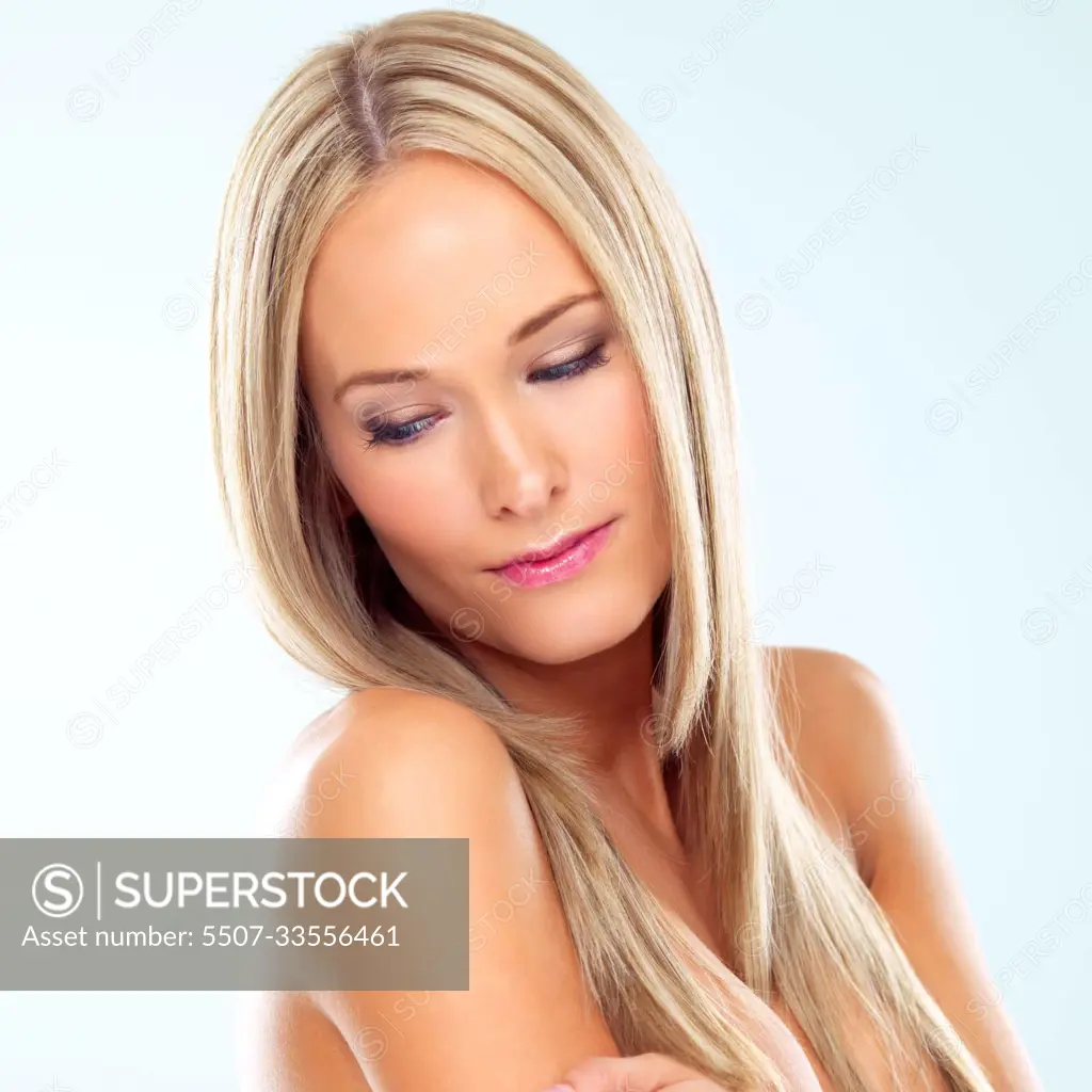 Beauty in perfection. A gorgeous topless model posing in a studio. -  SuperStock