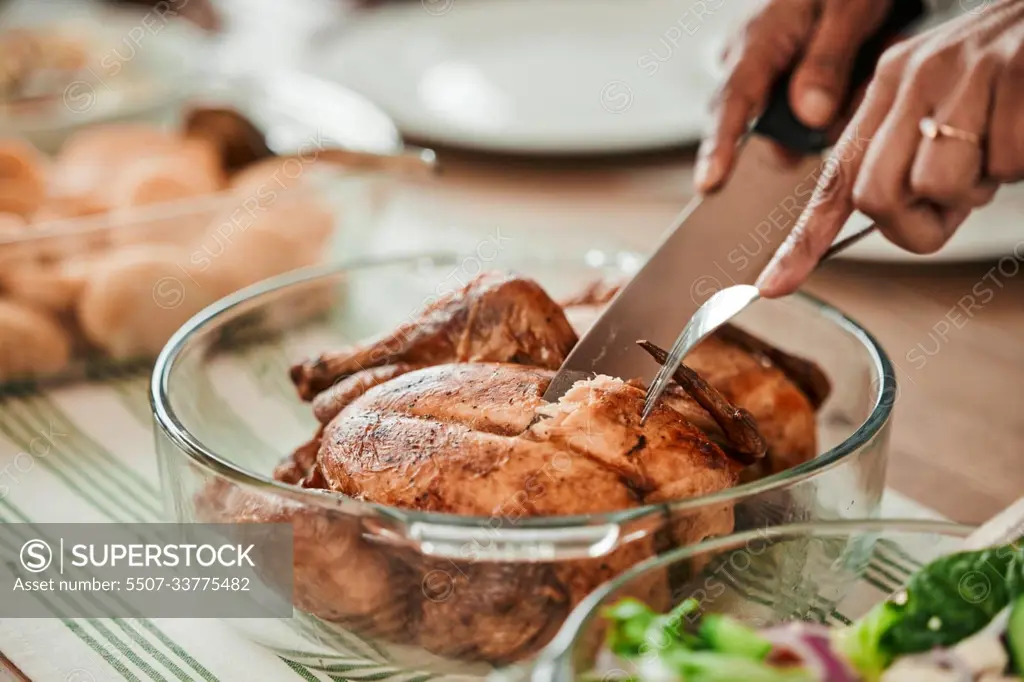 Hands, cutting turkey and thanksgiving in closeup, lunch or food for event, celebration and nutrition. Person, cutlery and chicken food for eating, share and culture for diet, zoom or dinner in home