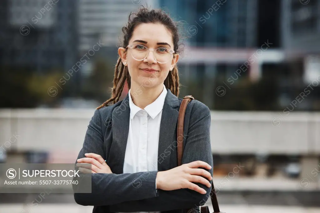 Business woman, professional portrait and arms crossed outdoor with a career and creative job pride. City, entrepreneur and work commute in morning with female person from New York in urban town