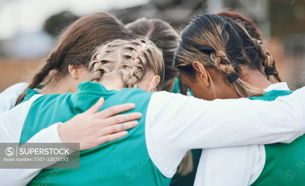 Hug, sports women or team in huddle with support, solidarity or plan for a hockey training game. Group, strategy or female athletes in practice for fitness exercise or match together for teamwork