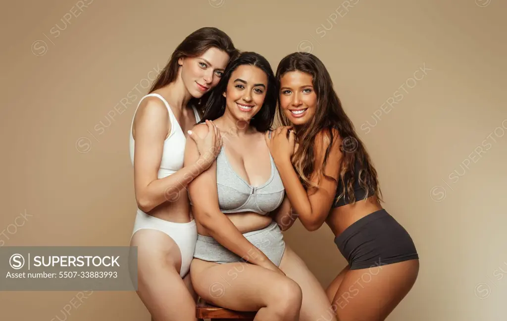 Natural beauty care. Smiling millennial diverse women in underwear enjoy  health care - SuperStock