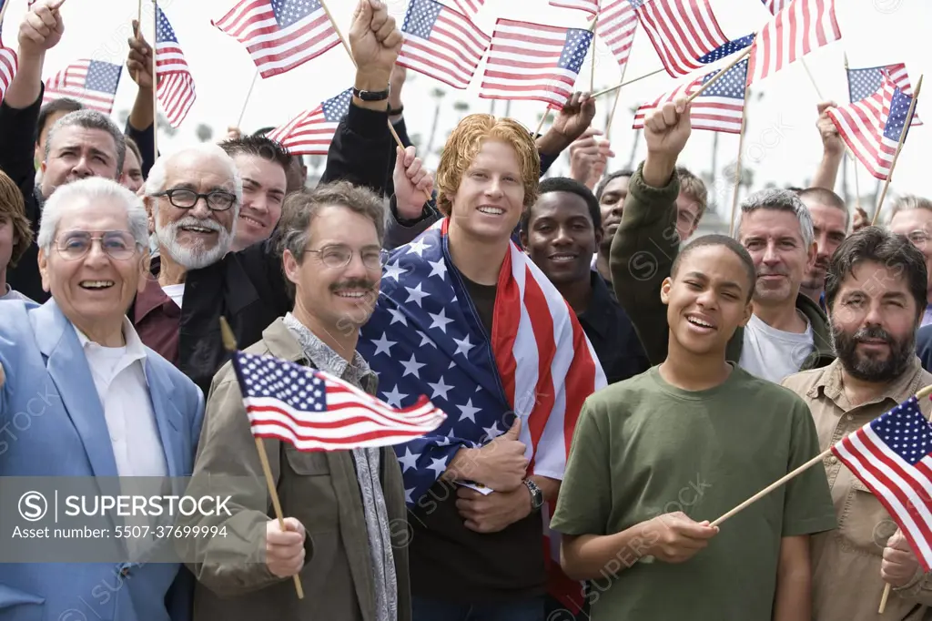 Crowd holding American flags