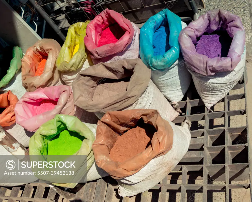 Sacks with paint pigment in different colors