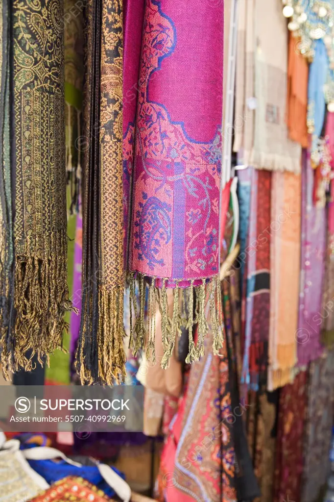 Colourful pashminas and fabrics for sale at Bur Dubai souq, Dubai, UAE