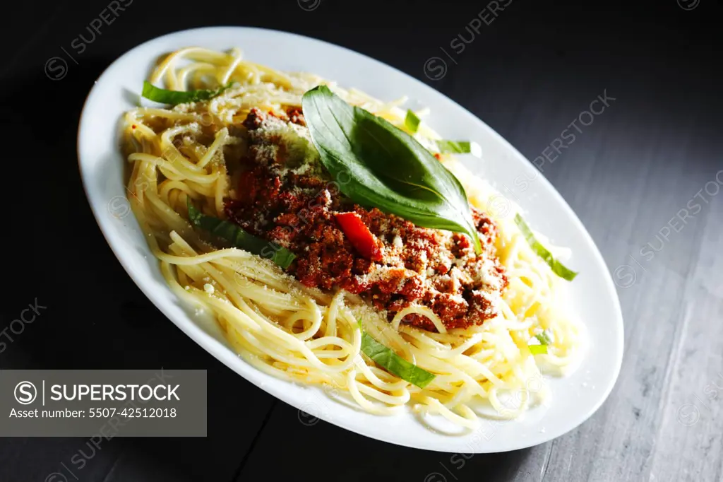 Spaghetti bolognese with basil