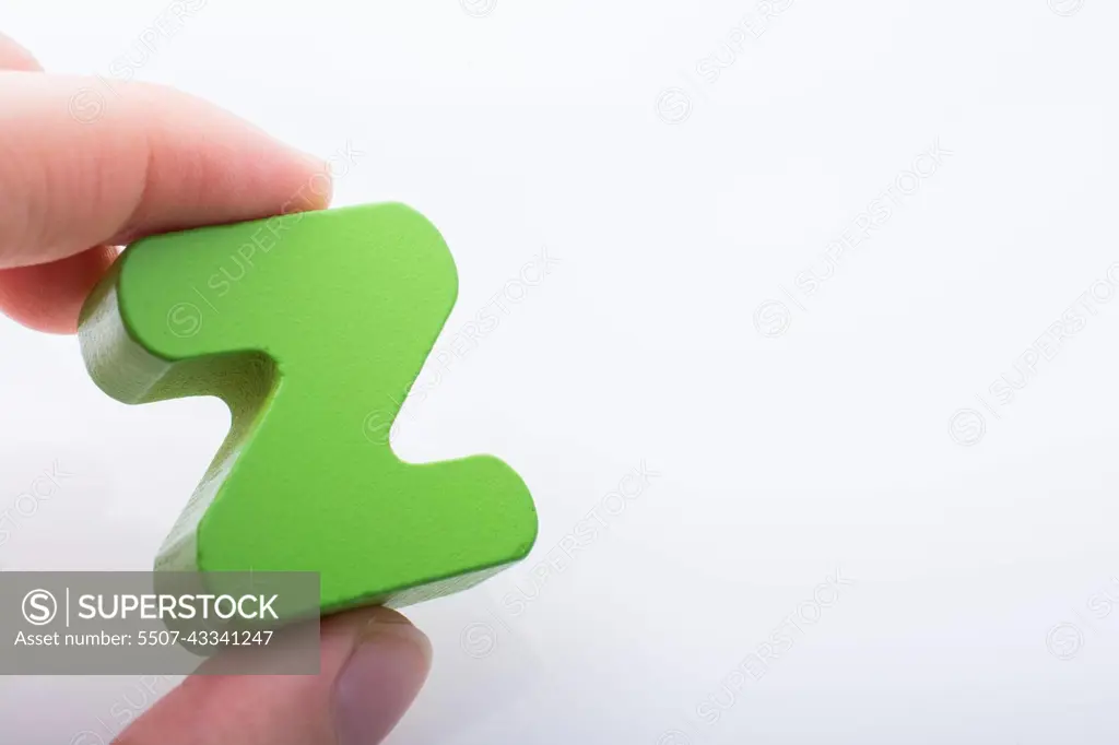 Hand holding Letter cube  Z of  Alphabet