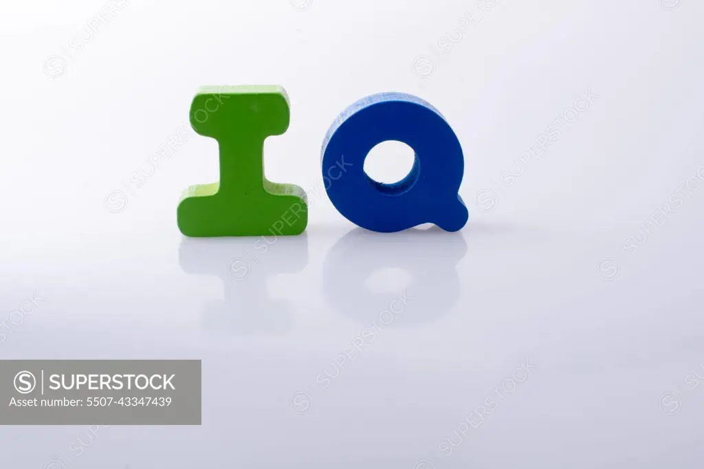 the word IQ written with letter blocks