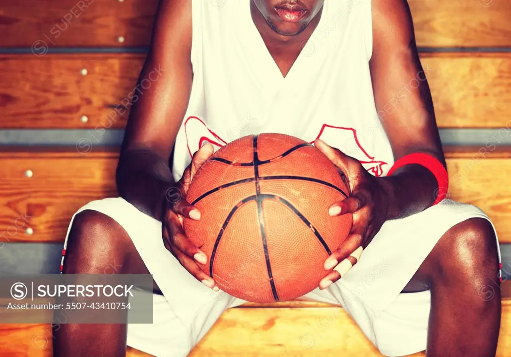 Basketball Player holding basketball